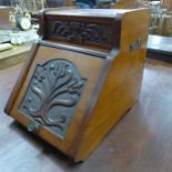 An Edward VII walnut coal scuttle