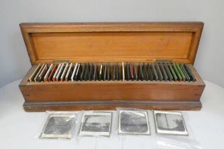 A box of forty Victorian era magic lantern slides