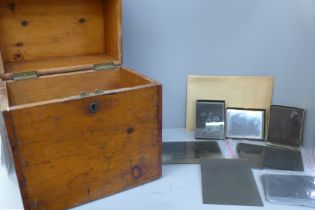 A wooden box of sixty Victorian era glass plate negatives