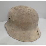 A German helmet shell, cracked, possible war damage