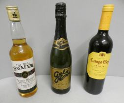 A bottle of The Real Mackenzie scotch whisky, Camoviejo Rioja and Gala Clubs demi-sec sparking wine