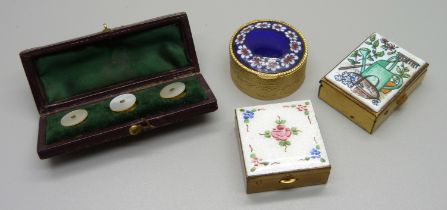 A guilloche enamel topped pill box, two other enamelled pill boxes and a cased set of mother of