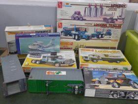 A collection of model kits, including Matchbox Ford Louisville, Peerless Roadrunner, White Road