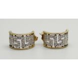 A pair of 9ct gold cuff style earrings set with 22 diamonds, 2.6g