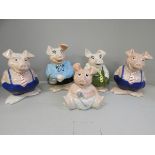 Five Wade Nat West piggy banks, one missing a stopper