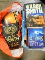 24 Wilbur Smith books including The New Kingdom, The Burning Shore and a Blue Horizon **PLEASE