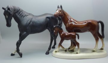 A Beswick horse, Black Beauty and one other horse and foal group