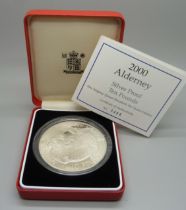 A Royal Mint 2000 Alderney Silver Proof Ten Pounds coin, boxed, with certificate no.0468, 155.55gms,