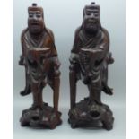 A pair of Chinese hand carved figures of elders, both with small losses, one with bone teeth, 20.5cm