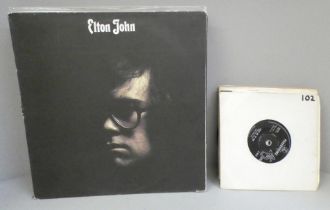 Seven LP records including The Rolling Stones, Elton John and Rod Stewart and a collection of 45 rpm