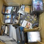 A box of Magic The Gathering gaming/playing cards