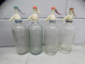 A collection of assorted glass bottles, mostly Victorian including medicine and some with labels,