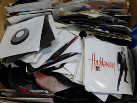 A large box of 1970s and 1990s 7" singles