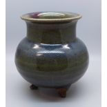 A studio pottery three footed glazed pot