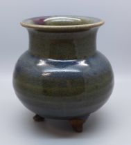 A studio pottery three footed glazed pot