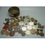 A collection of medallions, coins, badges, buttons, etc.