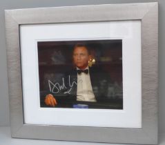 A Daniel Craig signed photograph with Certificate of Authentication