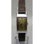 A stainless steel Titus Geneve manual wristwatch, 18mm wide case