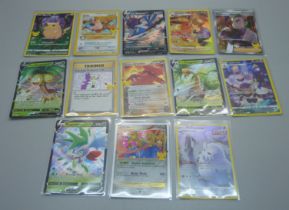 Thirteen Pokemon cards including V-Max, Celebration Holos, etc.