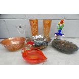A pair of orange carnival glass vases, two bowls and tray, a Murano glass clown and bird shaped bowl