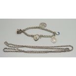 A silver charm bracelet, 11g, and a chain