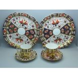 A pair of Royal Crown Derby 2451 pattern plates, cup and saucer and an Imari coffee can and