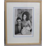 Elvis Presley and Prescilla Presley, 16 x 10" photograph, holding a very young Lisa Marie, taken