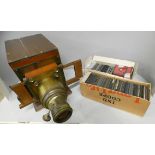 A part Magic Lantern projector and a collection of Magic Lantern slides (117) including travel,