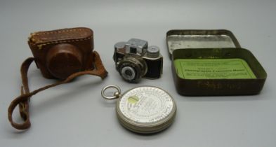 A Mycro Spy camera, Sanwa Co., made in Japan, and a Wynne's Infallible Exposure Meter, with tin