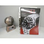 A novelty Global clock and four books on wristwatches