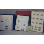 An album of British stamps including 19th Century, one other album of British stamps and an album of