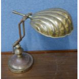 A brass anglepoise desk lamp