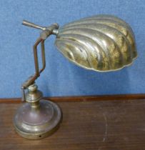 A brass anglepoise desk lamp