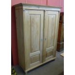 A 19th Century style French pine two door armoire