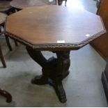 A 19th Century Italian Baroque style carved oak octagonal lamp table
