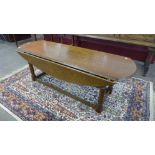 An oak drop-leaf coffee table