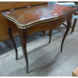 A 19th Century French mahogany and brass inlaid serpentine games table