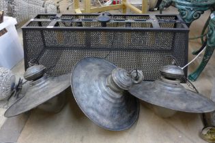 A set of three industrial style metal ceiling lights and one other