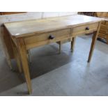 A Victorian pine two drawer side table