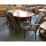 A McIntosh teak extending dining table and six chairs