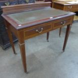 An Edward VII inlaid mahogany and green leather topped two drawer writing table