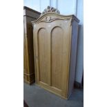 A 19th Century style French pine single door armoire
