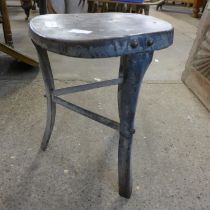 An industrial steel stool