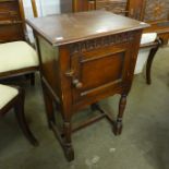 A 17th Century style carved oak pot cupboard