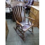 A Victorian elm and beech farmhouse rocking chair