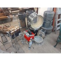 A vintage Pearl drum kit and cases