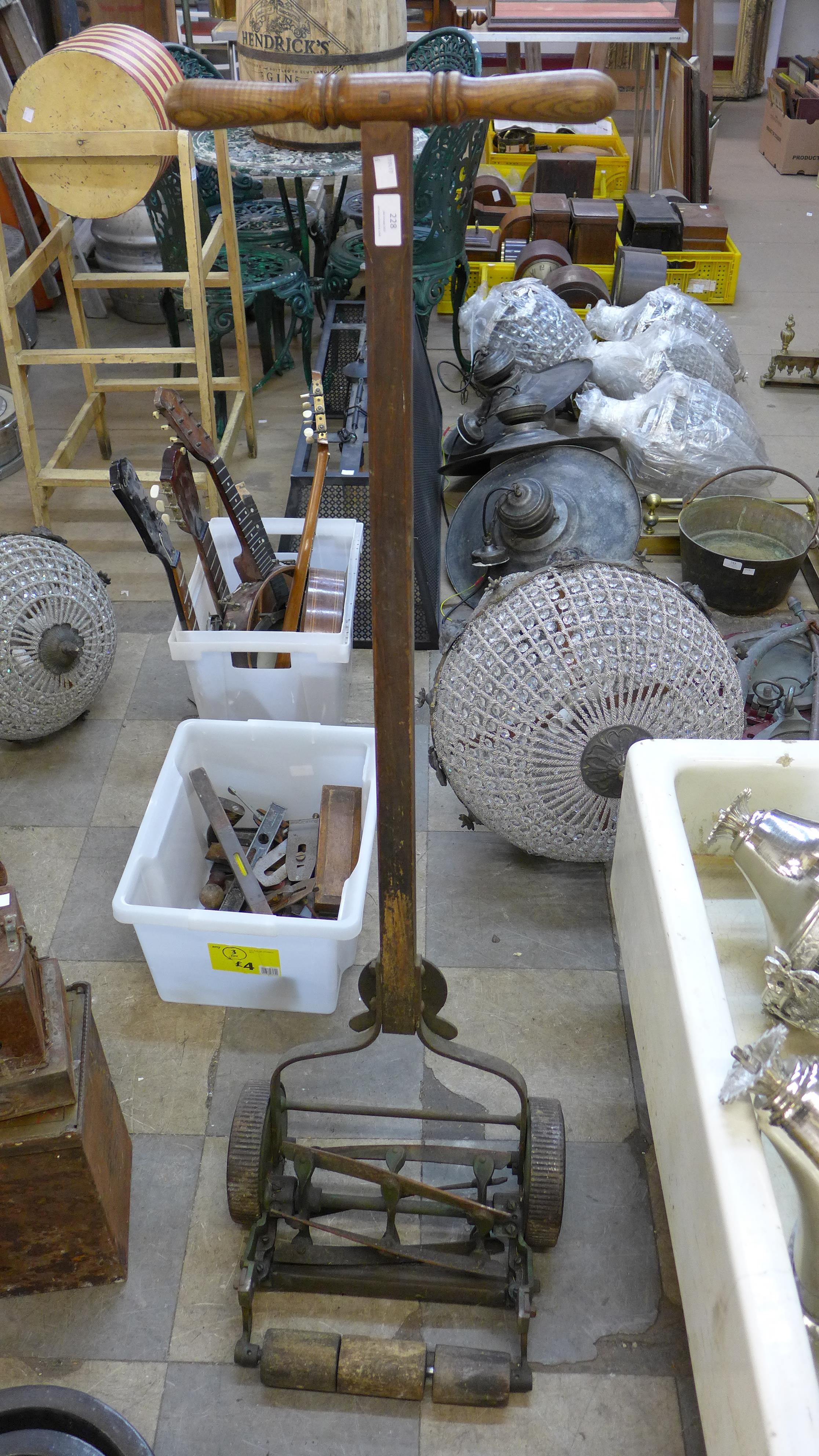 Four painted terracotta planters, a vintage lawnmower, tin bath, etc.