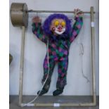 A motorised shop display oscillating clown