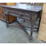 A17th Century Dutch carved oak single drawer side table