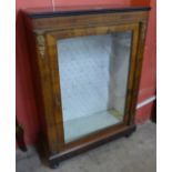 A Victorian figured walnut and gilt metal mounted pier cabinet